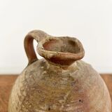 Small antique stoneware jar with handle
