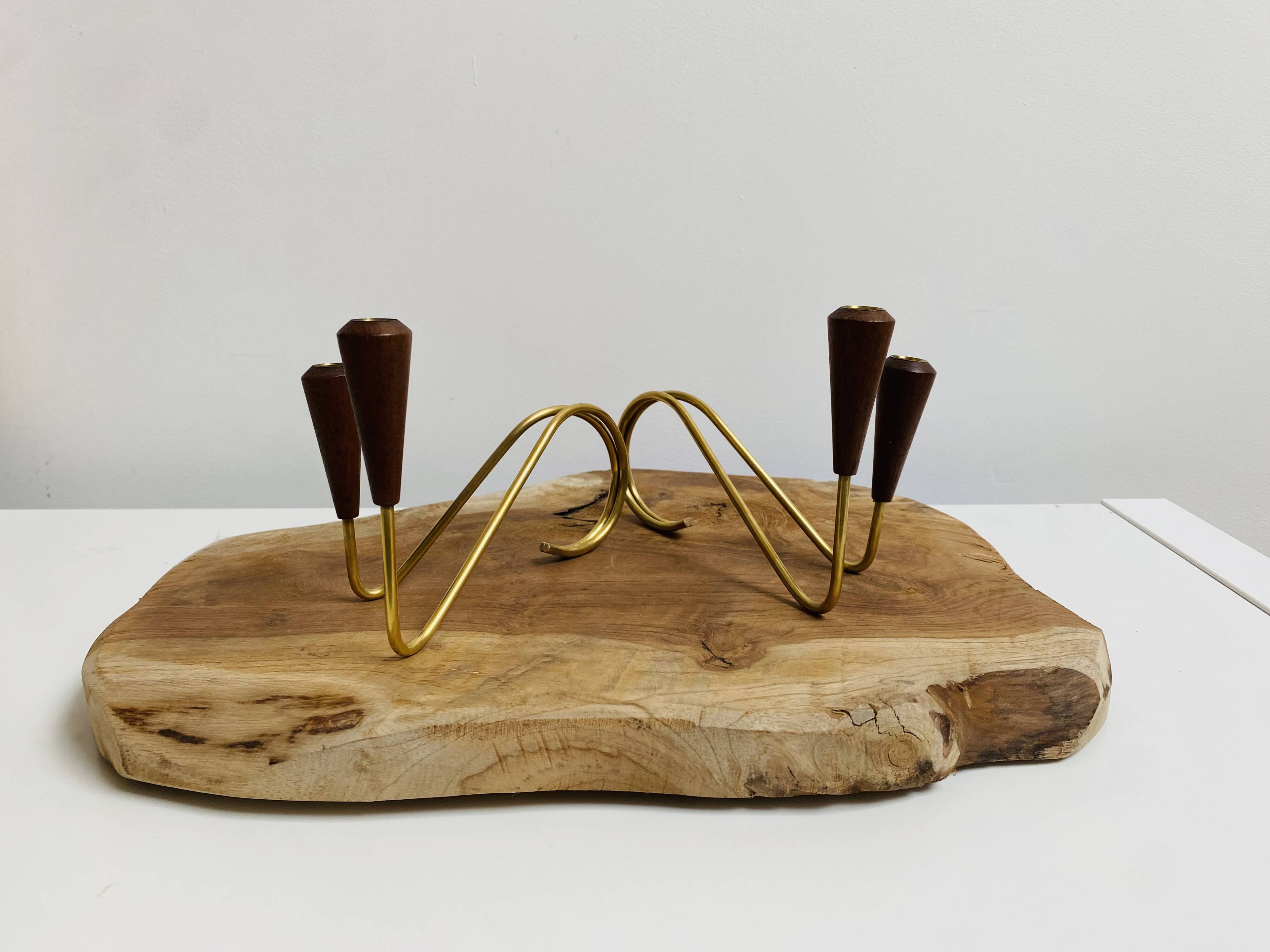 Pair of teak and brass candlesticks