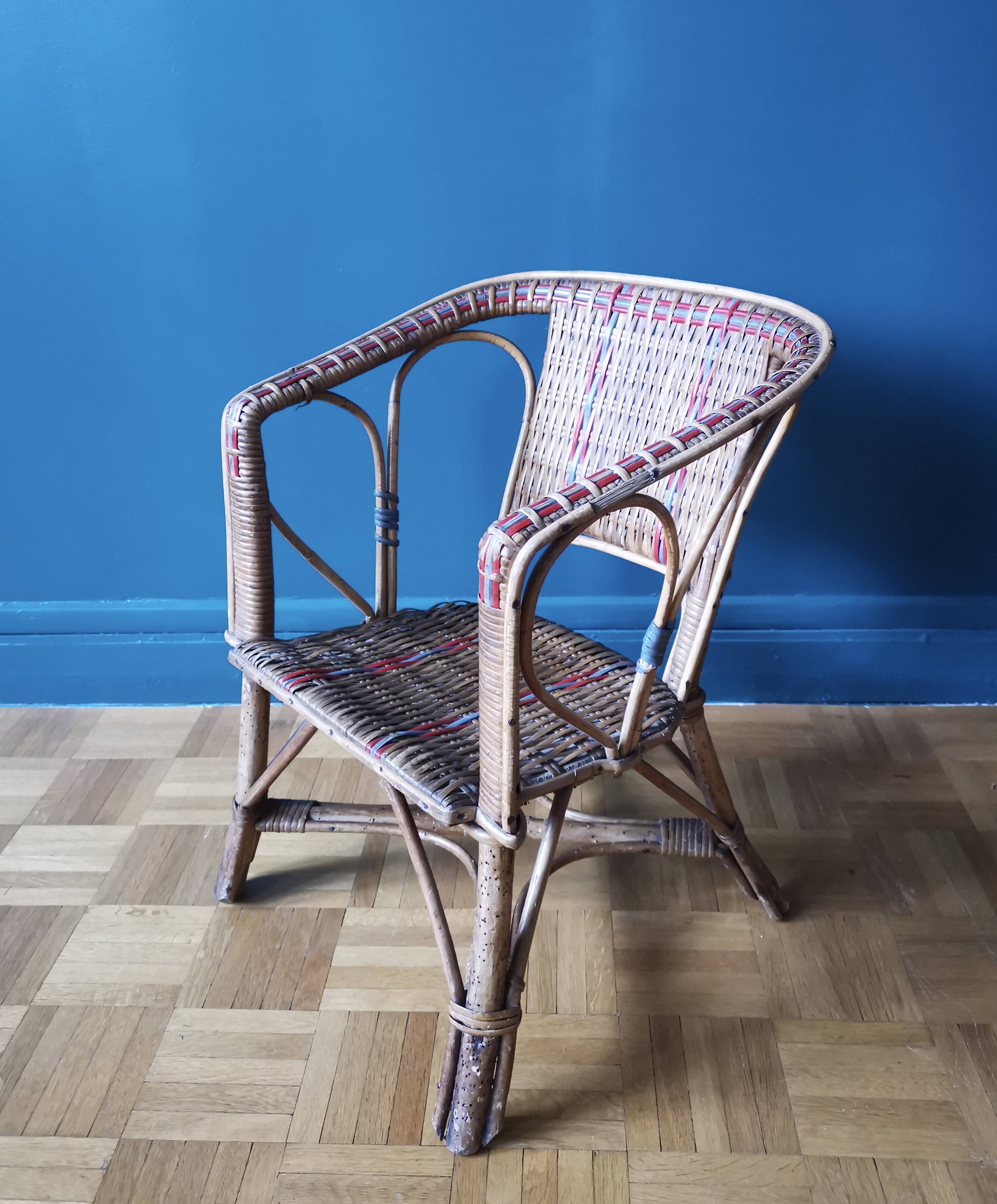 Small child vintage armchair in rattan