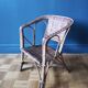 Small child vintage armchair in rattan
