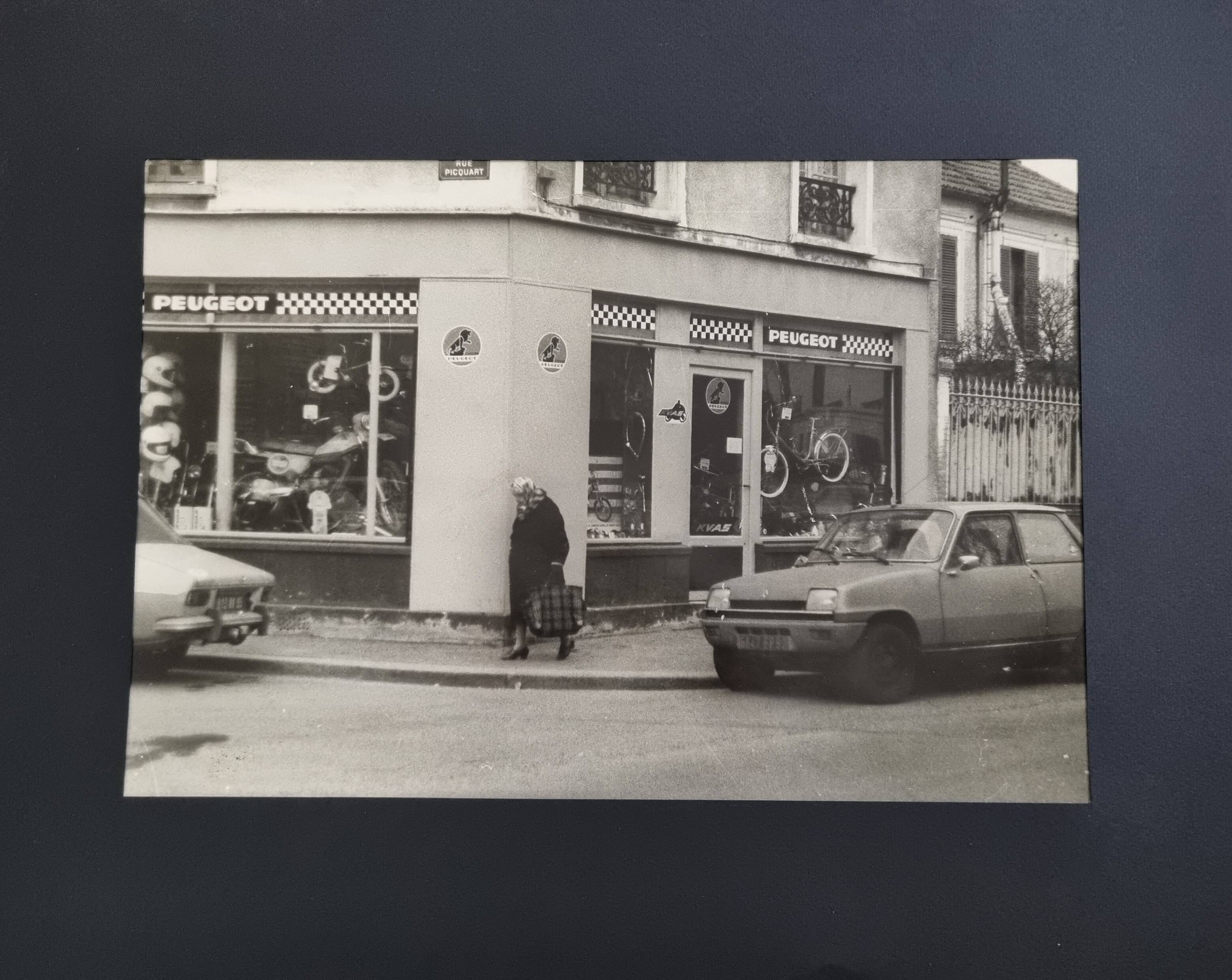 Vintage silver gelatin print of a street scene in a shop window, 1970s, framed, 52 x 42 cm