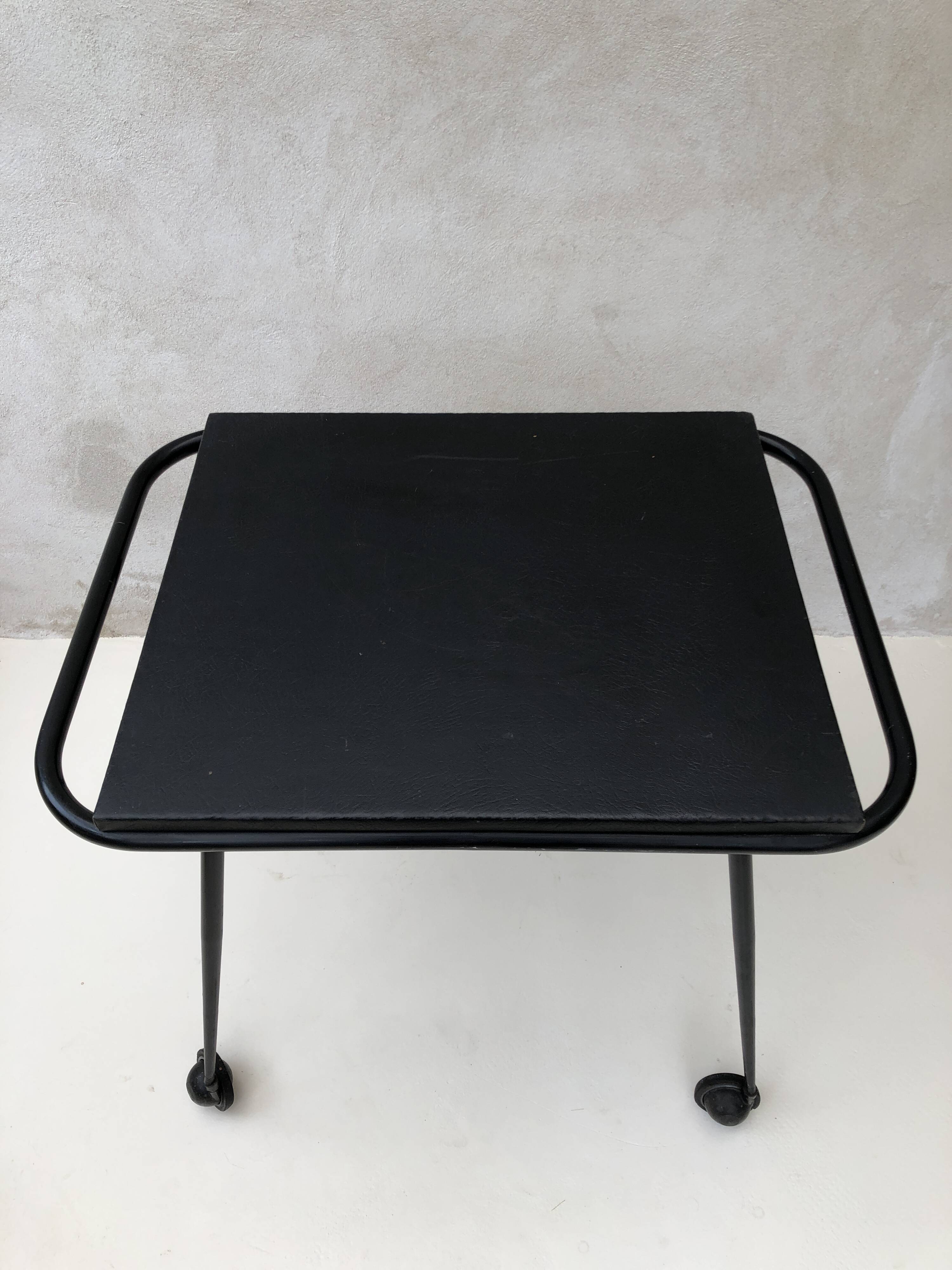 Black table on wheels from the 60s