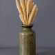 Wabi-sabi artisanal stoneware vase in green and earth tones.