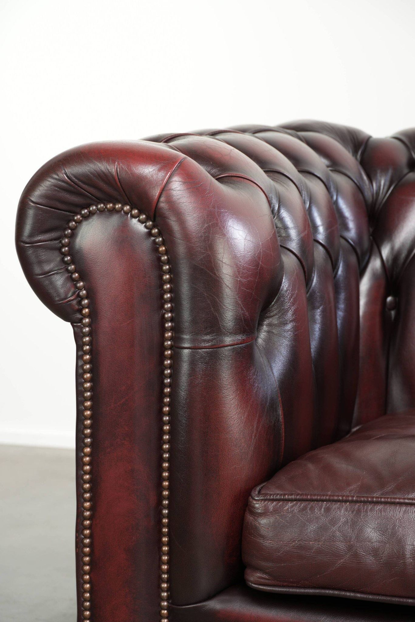 English cowhide Chesterfield club armchair in a beautiful red colour