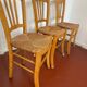 Trio of vintage straw/colored chairs