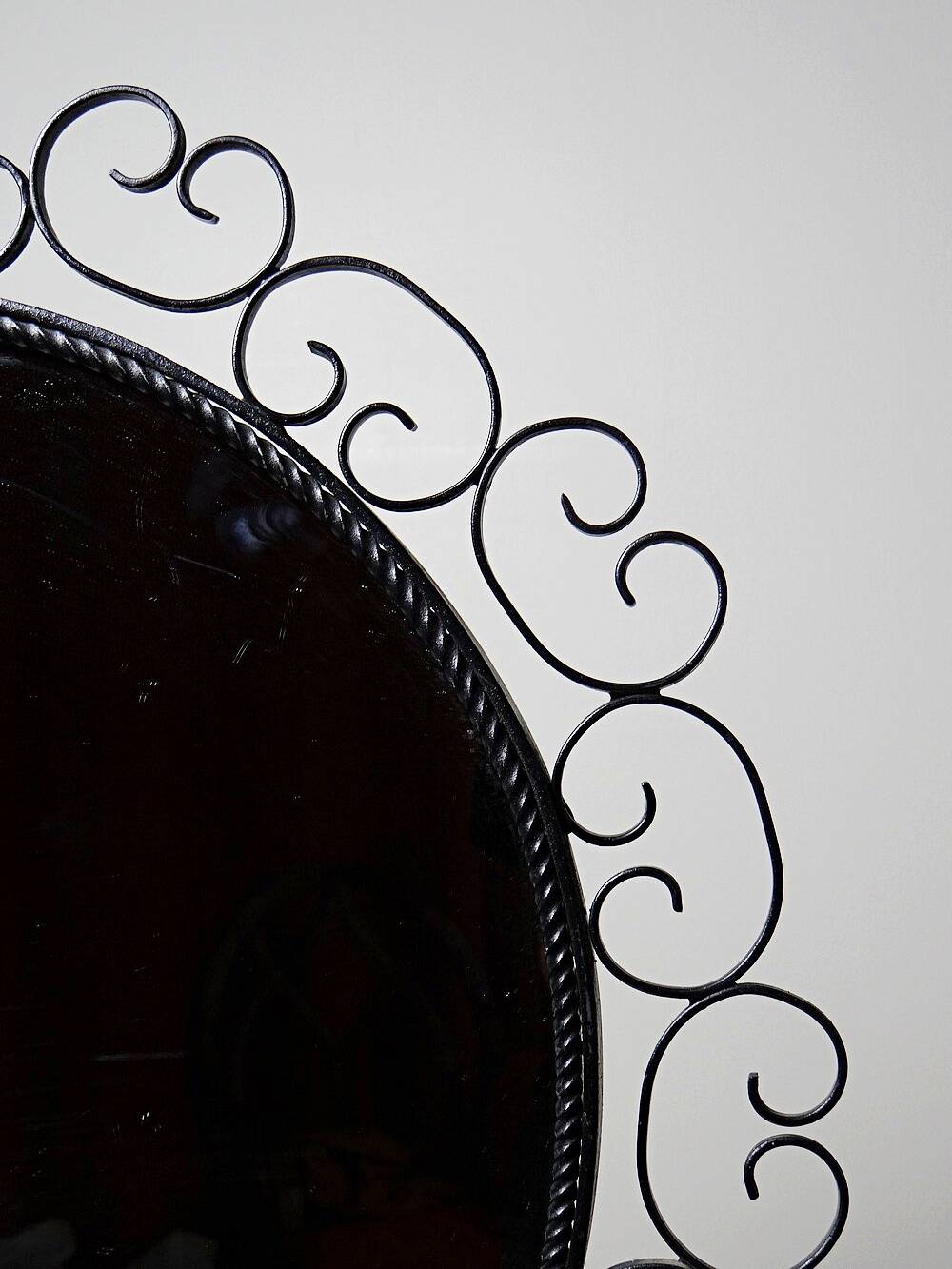 Vintage round wall mirror from the 60s and 70s, wrought iron arabesques