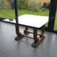 Art Deco coffee table in glass, wood, and brass.