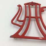 cast iron underside in the shape of a coffee maker