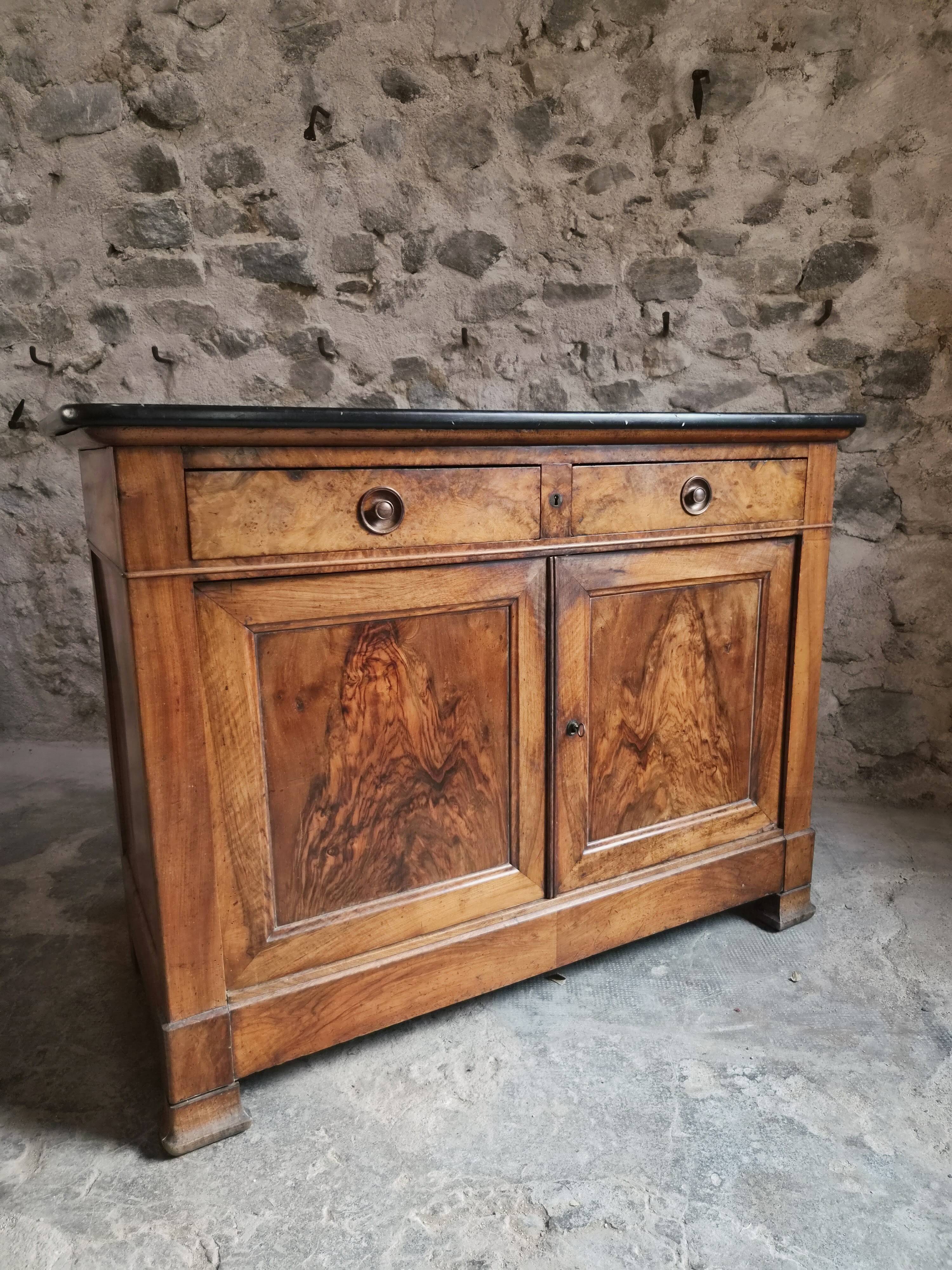 French Louis Philippe walnut buffet with black marble top, France, circa 1840–1860.
