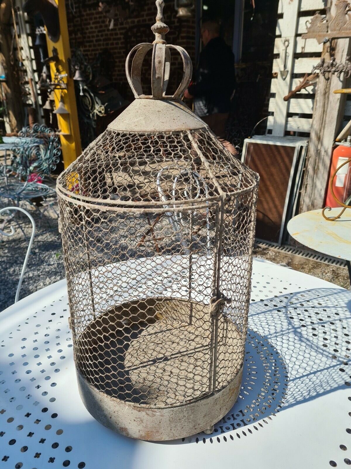 iron bird cage with a crown