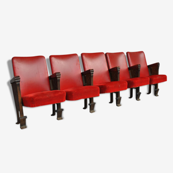 Series of 5 red skai and patinated cast Theater chairs