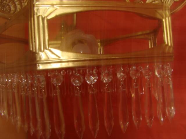 Art Deco period chandelier (1925) with four light arms.