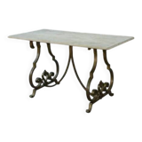 Side table with a gilt wrought iron base attributed to Gilbert Poillerat, with a travertine top, 1940s