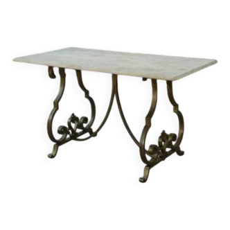 Side table with a gilt wrought iron base attributed to Gilbert Poillerat, with a travertine top, 1940s