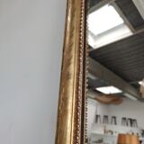 Long wooden mirror and gilded stucco with pearl rays H: 2m45 L: 40cm