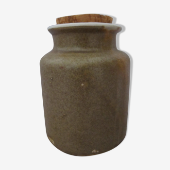 Old mustard pot in sandstone
