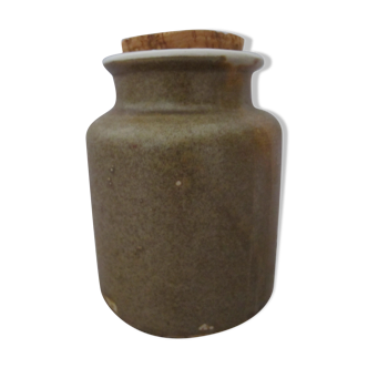 Old mustard pot in sandstone