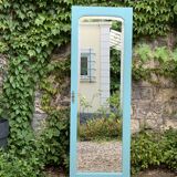 Beveled mirror on turquoise Parisian door