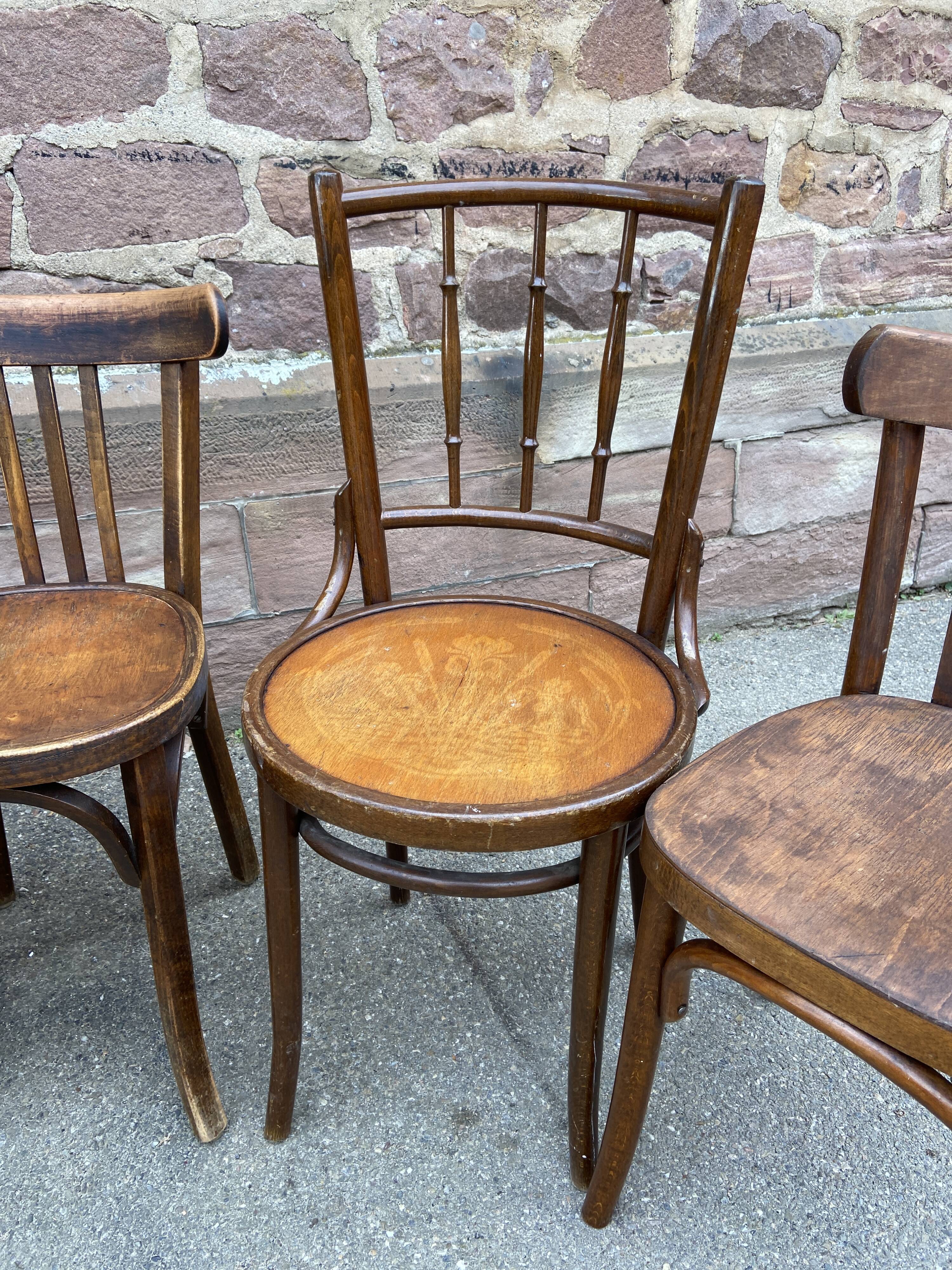 Lot 6 mismatched wooden bistro chairs