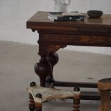 Vintage African artisanal stool, triangular shape with 3 legs, cowhide, 20th century.