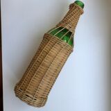 bottle surrounded by rattan 70s