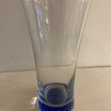 Glass roller vase with blue bubble background