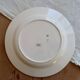 Round vintage ivory earthenware serving dish with double gold trim.