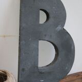 Letter of sign in zinc