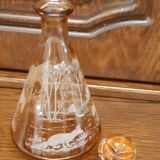 Moulded blown glass decanter with equestrian fox hunting décor, belle époque