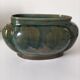 Art Deco flared cache-pot in turquoise glazed earthenware.