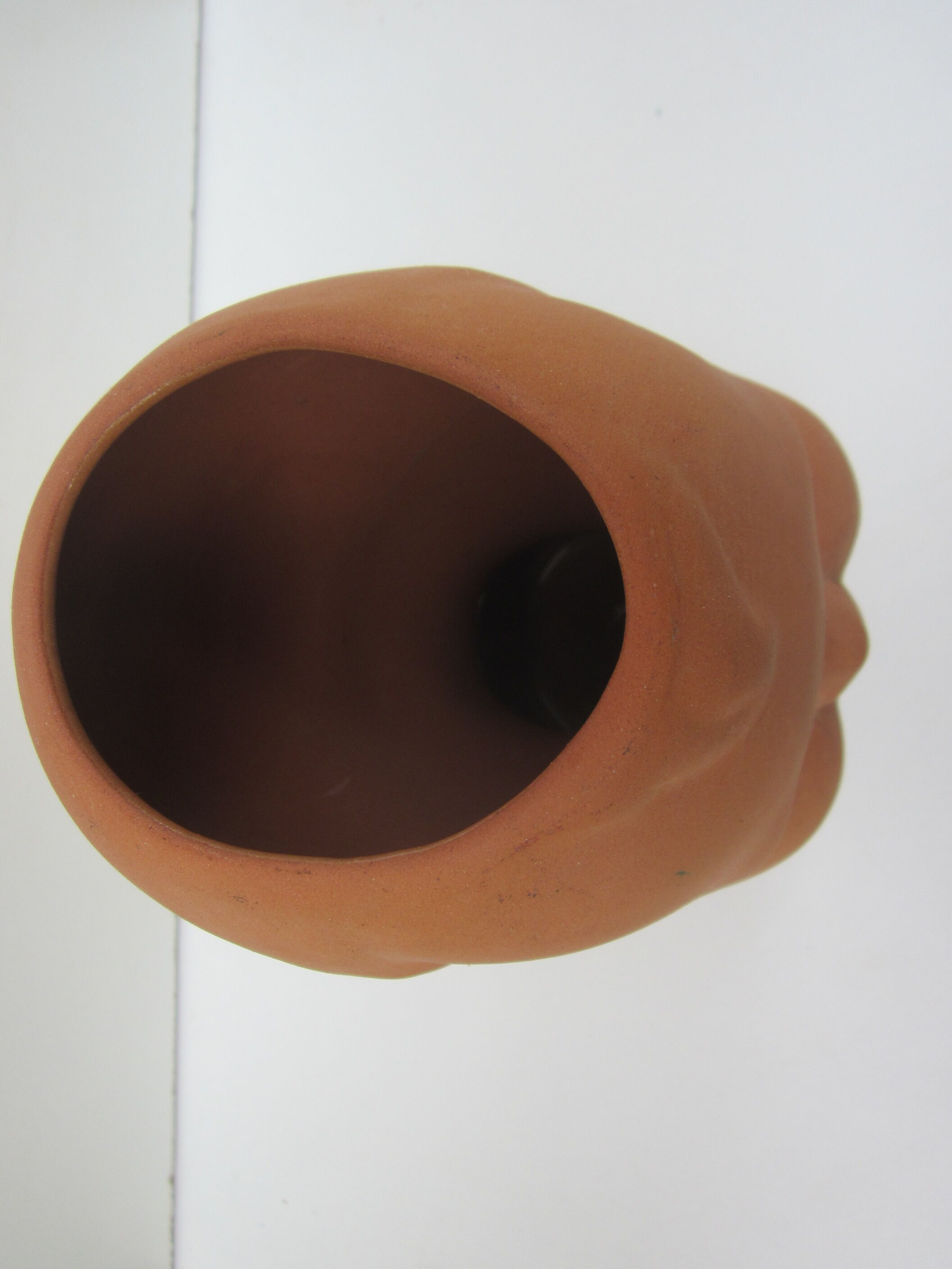 Terracotta vase: child's head