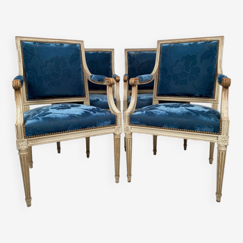 Suite of four Louis XVI style armchairs, white lacquered wood and blue velvet