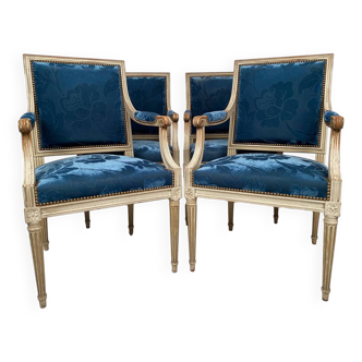 Suite of four Louis XVI style armchairs, white lacquered wood and blue velvet