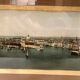 Panoramic view of Venice in a 20th century carved walnut frame