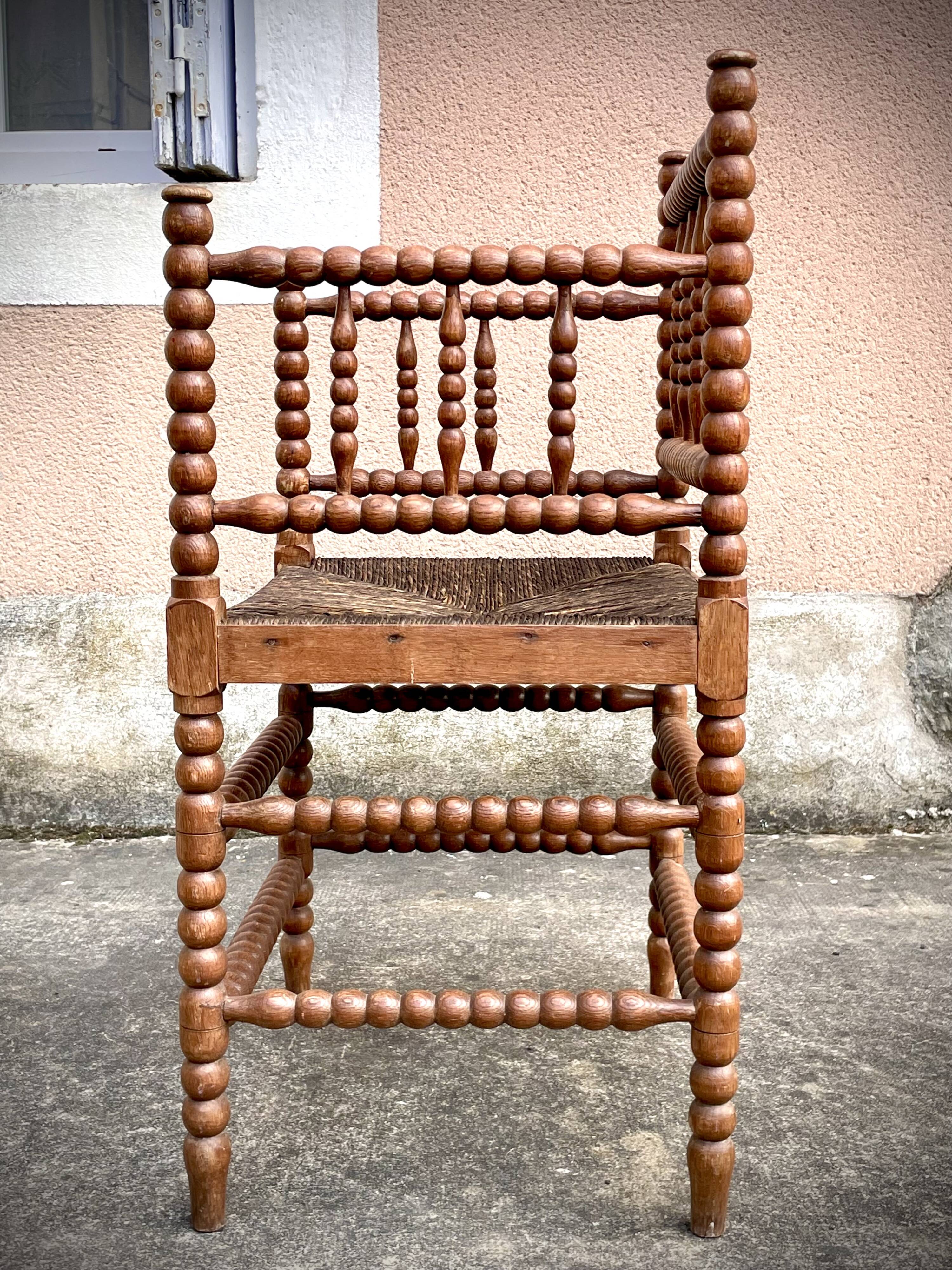Antique Bobbin armchair with straw seat