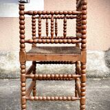 Antique Bobbin armchair with straw seat