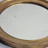 Antique round mirror in gilded wood, original patinated glass from the 19th century, 34 x 37 cm.