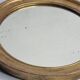 Antique round mirror in gilded wood, original patinated glass from the 19th century, 34 x 37 cm.