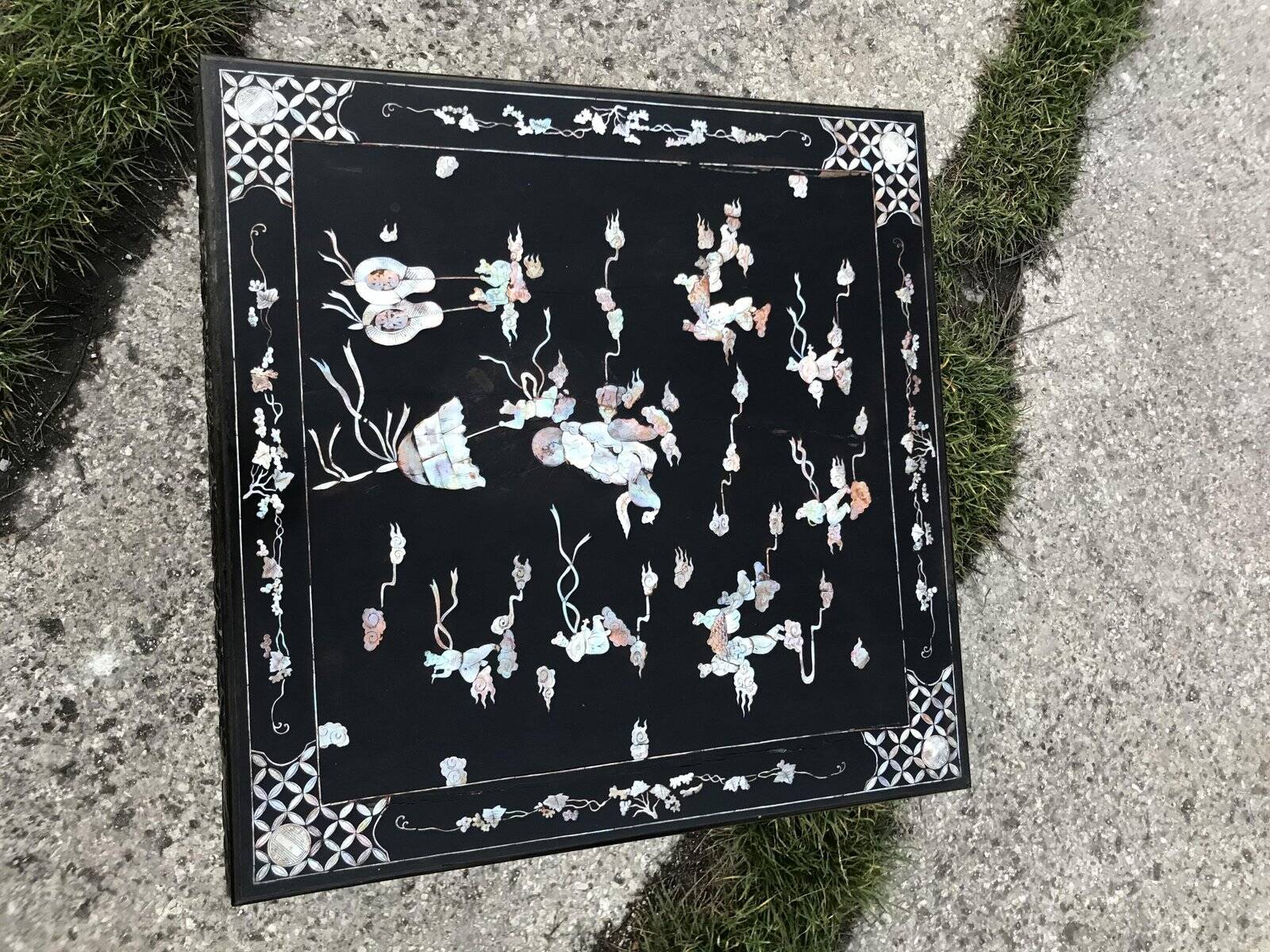Chinese black lacquer side table with multicoloured inlays, 1950s.