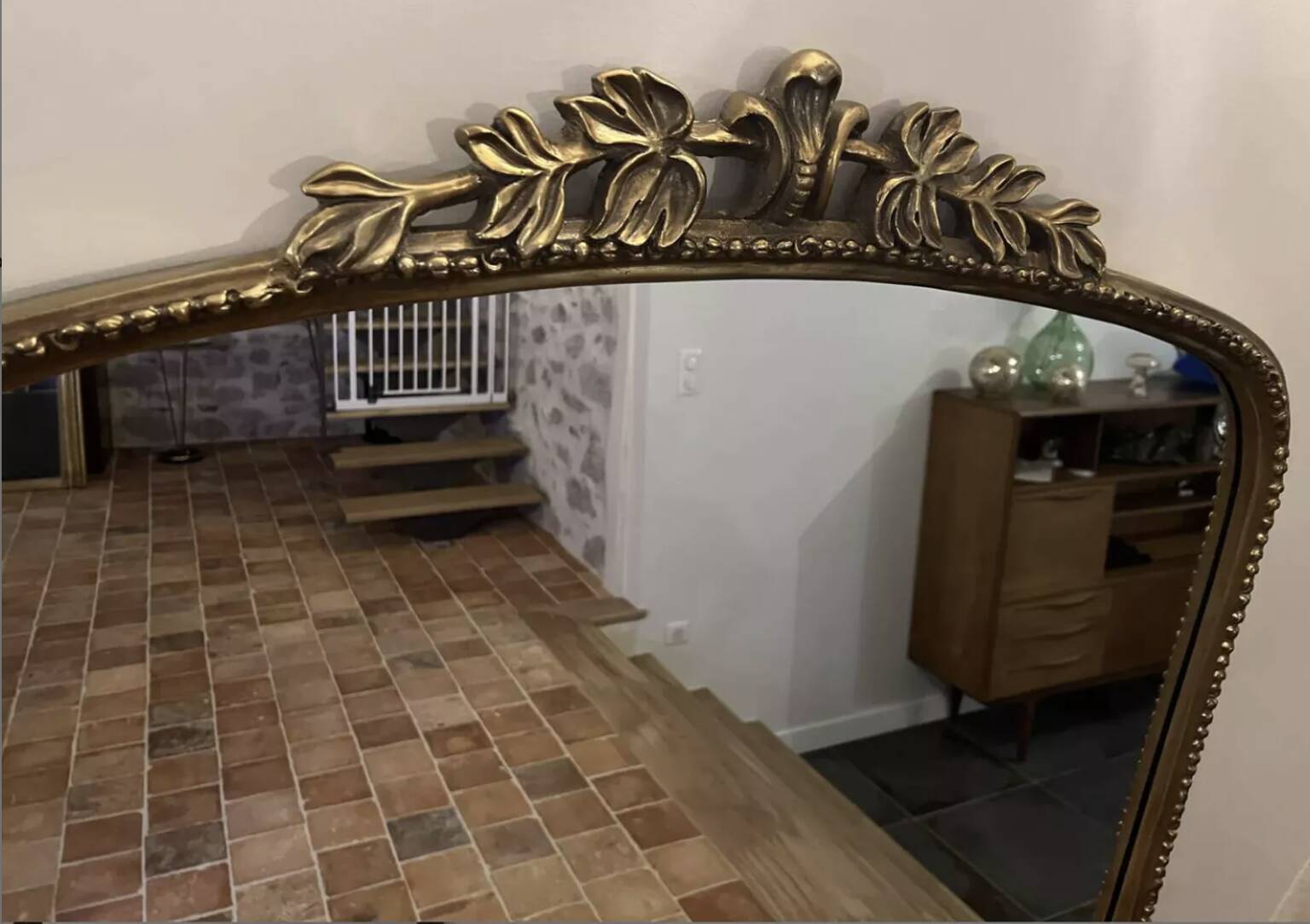 Large gilded mirror with pediment