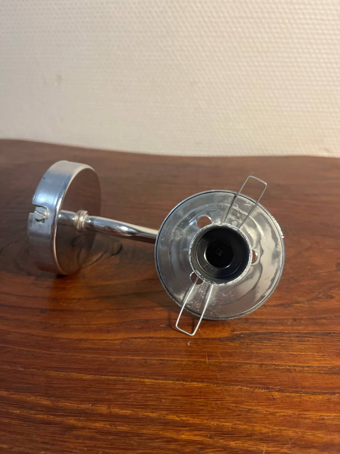 Delmas chrome wall light with chiseled glass globe