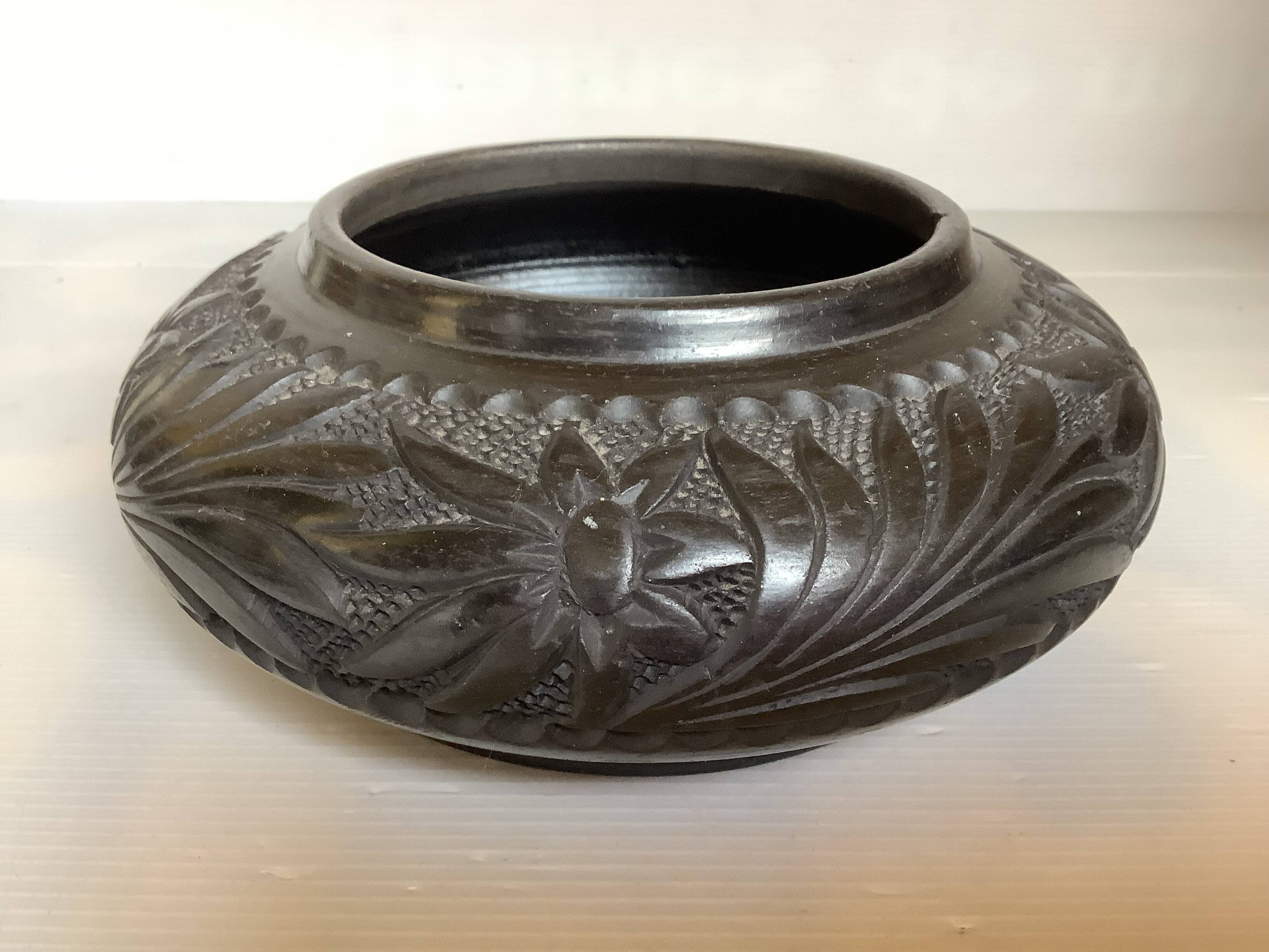 Black pottery catchall worked from Marginea, Romania.