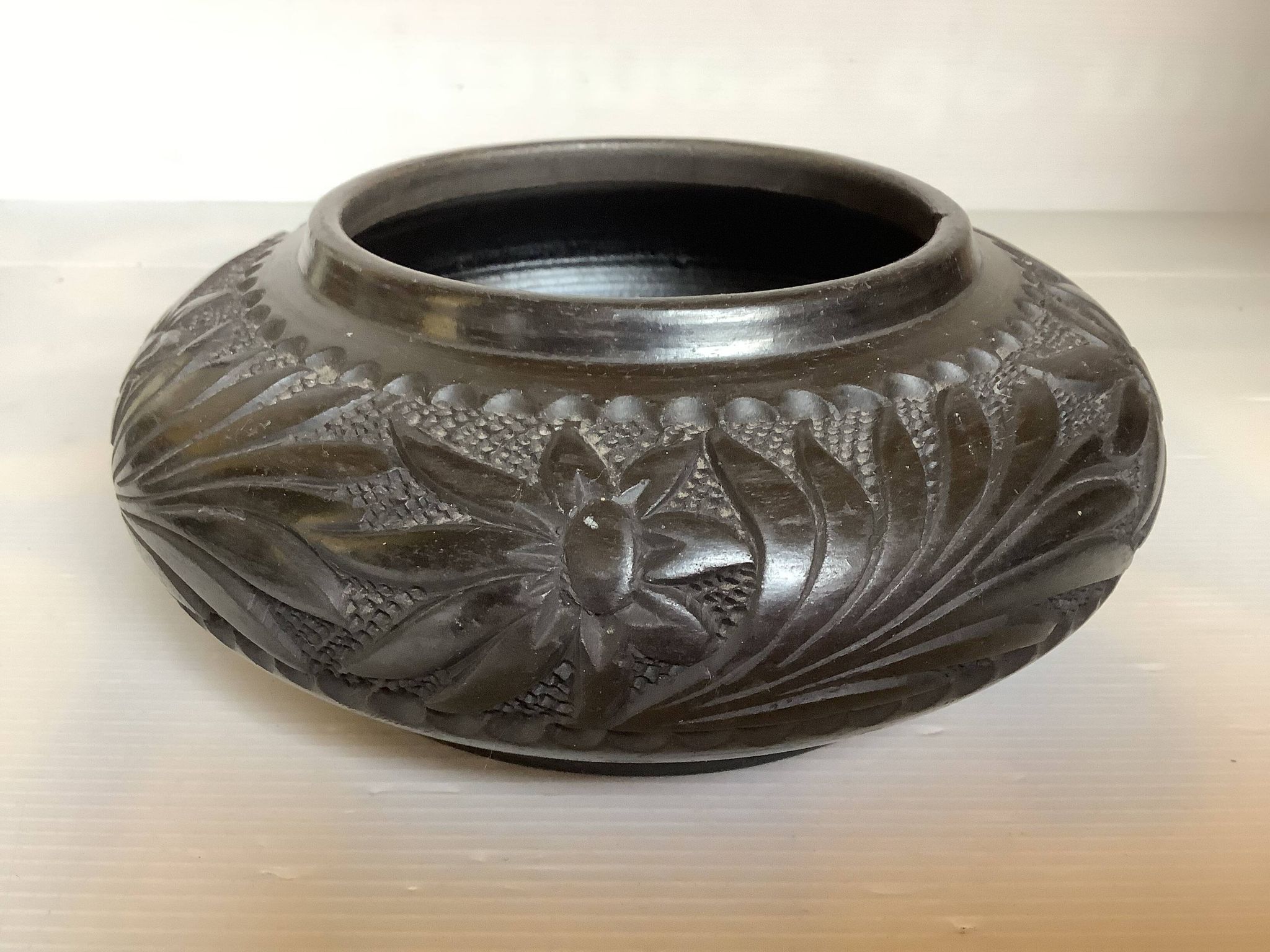 Black pottery catchall worked from Marginea, Romania.
