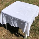 Old square table in damask cotton palm floral pattern