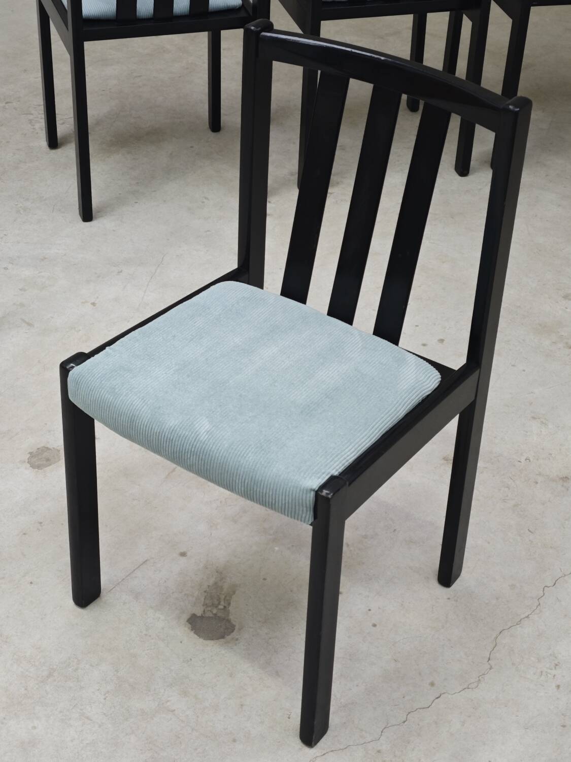 Set of 4 modernist black chairs with light blue ribbed fabric