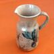 1960s Glazed terracotta pitcher with floral decoration