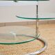 Table basse en verre et métal tubulaire avec plateaux pivotants