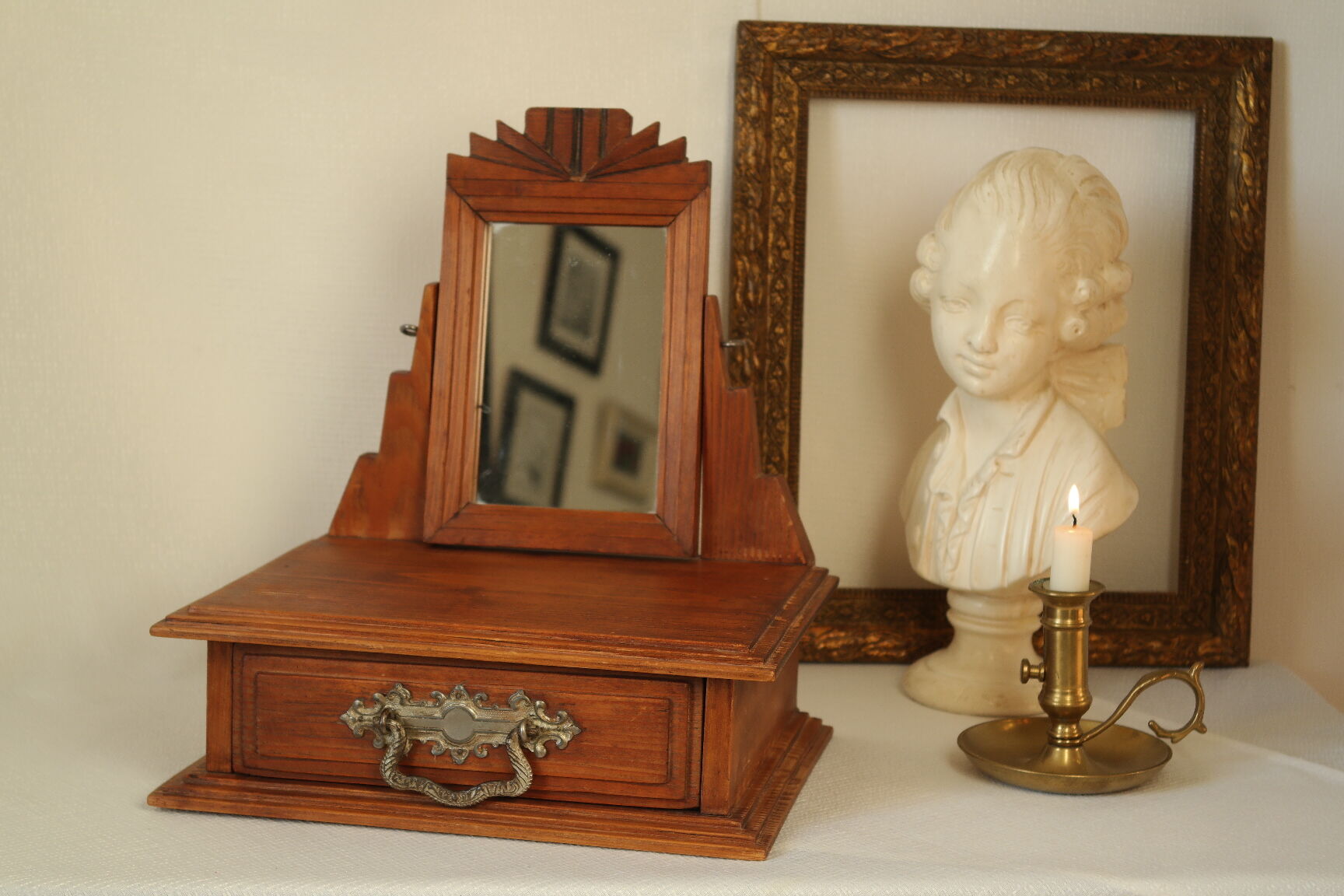Antique wooden table mirror in Art Deco style.