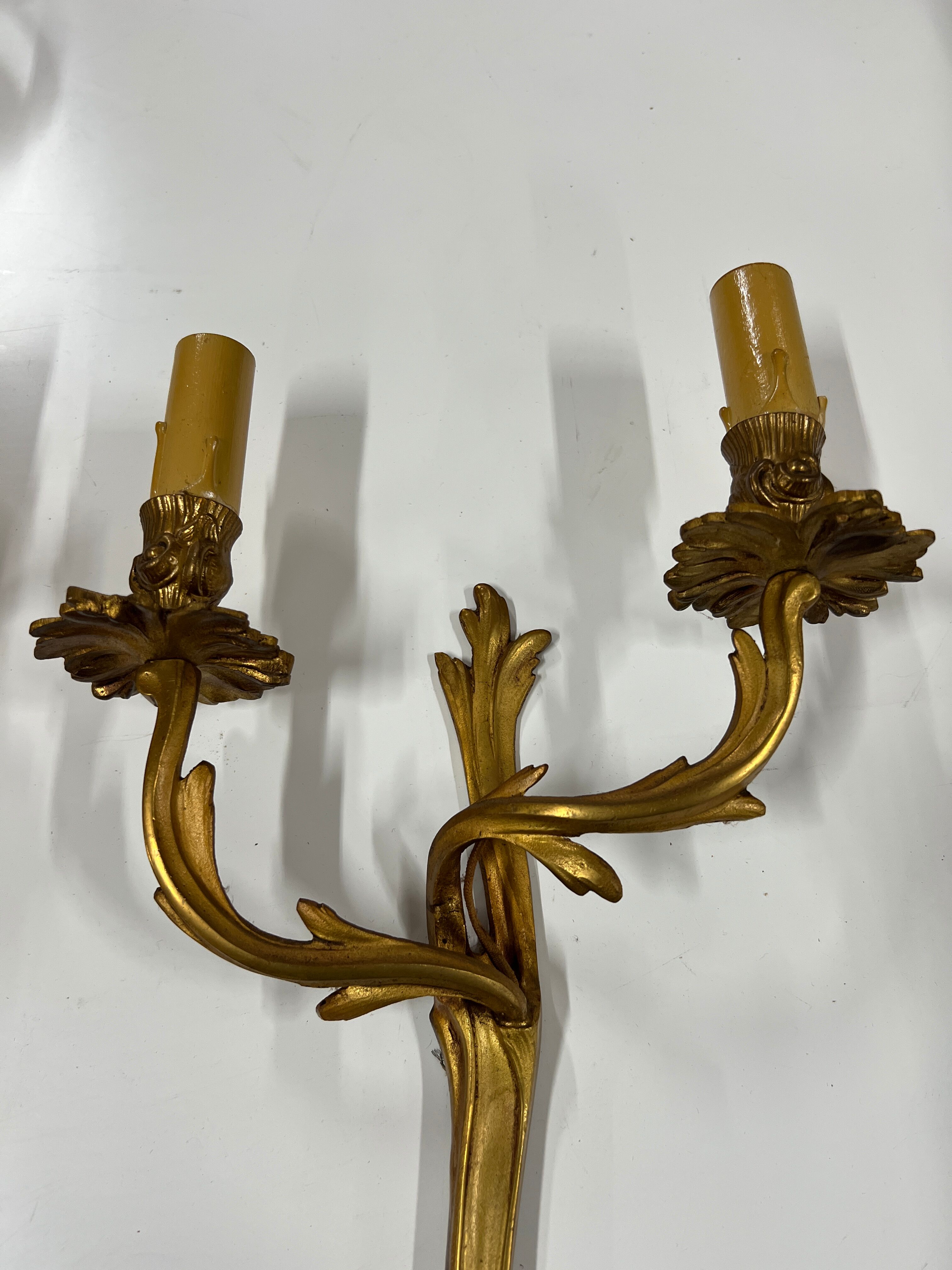 Pair of Louis XV wall lamps in gilded bronze