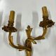 Pair of Louis XV wall lamps in gilded bronze